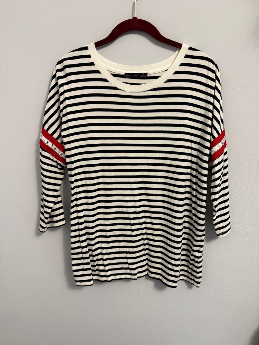 Black Tape_ Black and White Striped Long Sleeve Top with Red Sleeve Stripes